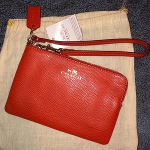 Orange Coach wristlet